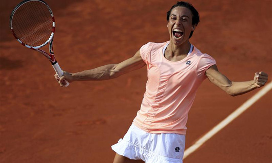 Francesca Schiavone celebrates after victory over Jelena Jankovic during French Open 2011