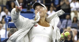 Djokovic and Wozniacki Solid